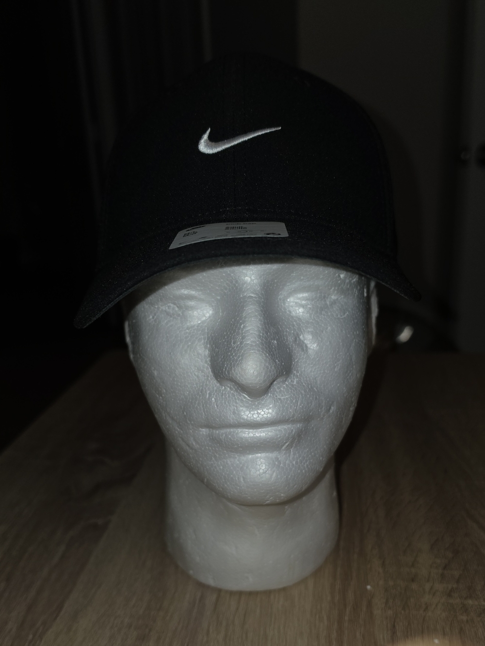 Nike Black Club Cap with White Swoosh.